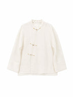 Ivory Chinese-inspired silk organza shirt with mandarin collar and decorative frog closures