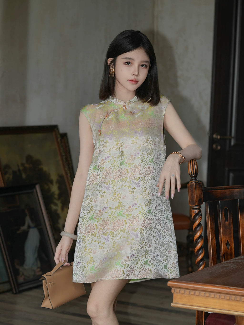 Front model view of an ivory floral silk-blend summer dress with a Mandarin collar and frog buttons.