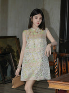 Front model view of an ivory floral silk-blend summer dress with a Mandarin collar and frog buttons.