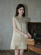 Model wearing an ivory sleeveless Mandarin-collar dress with delicate floral and butterfly motifs.