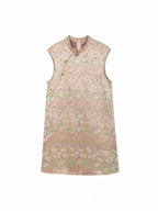 Front product view of a lightweight ivory sleeveless dress with an asymmetric neckline and frog closures.