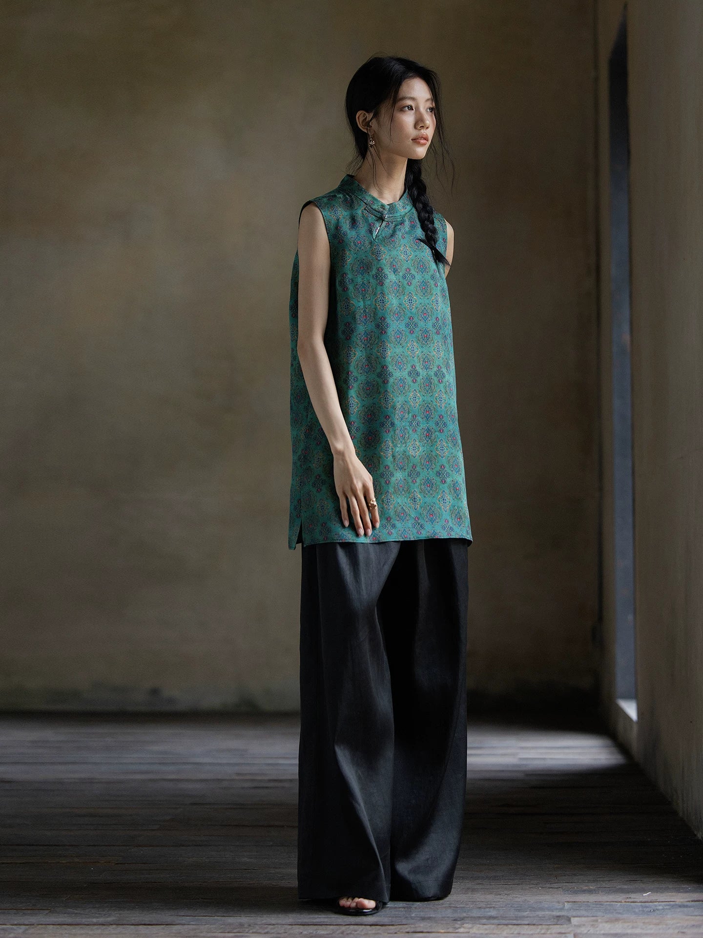 Full-length view of an emerald jacquard Gambiered Silk sleeveless tunic in relaxed fit.