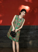 Lifestyle view of a model wearing a jade green modern Chinese Shu brocade silk dress.