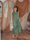 Model wearing a jade green 100% mulberry silk H-line dress with a mandarin collar