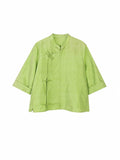 Front view of a jade green mulberry silk top with a stand collar and Chinese-inspired button closures