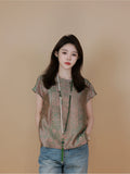 Model wearing a jade green Chinese-inspired mulberry silk top with short straight sleeves