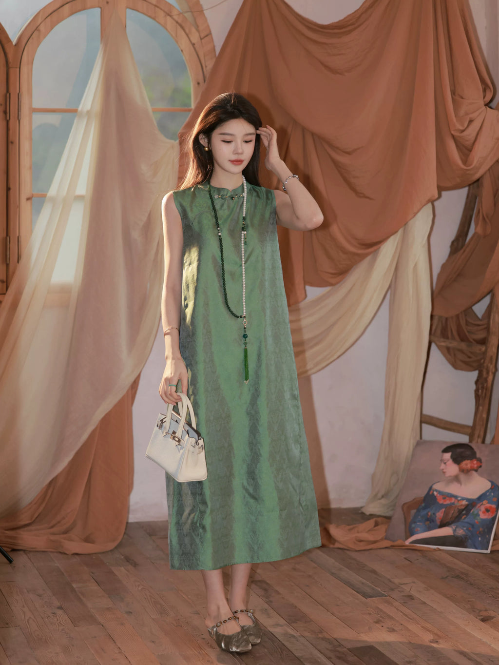 Full-length view of a jade green sleeveless 100% mulberry silk H-line dress