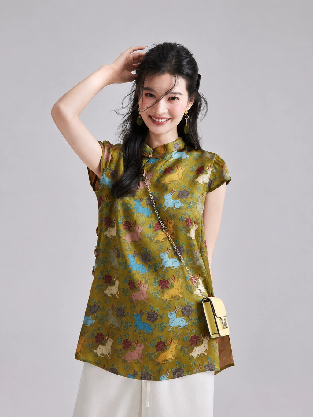 Front view of a Gambiered Silk artificial silk top with multicolored rabbit motifs, a Mandarin collar and short sleeves