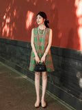 Model wearing a jade green multicolor Shu brocade sleeveless silk dress by Gambiered Silk.