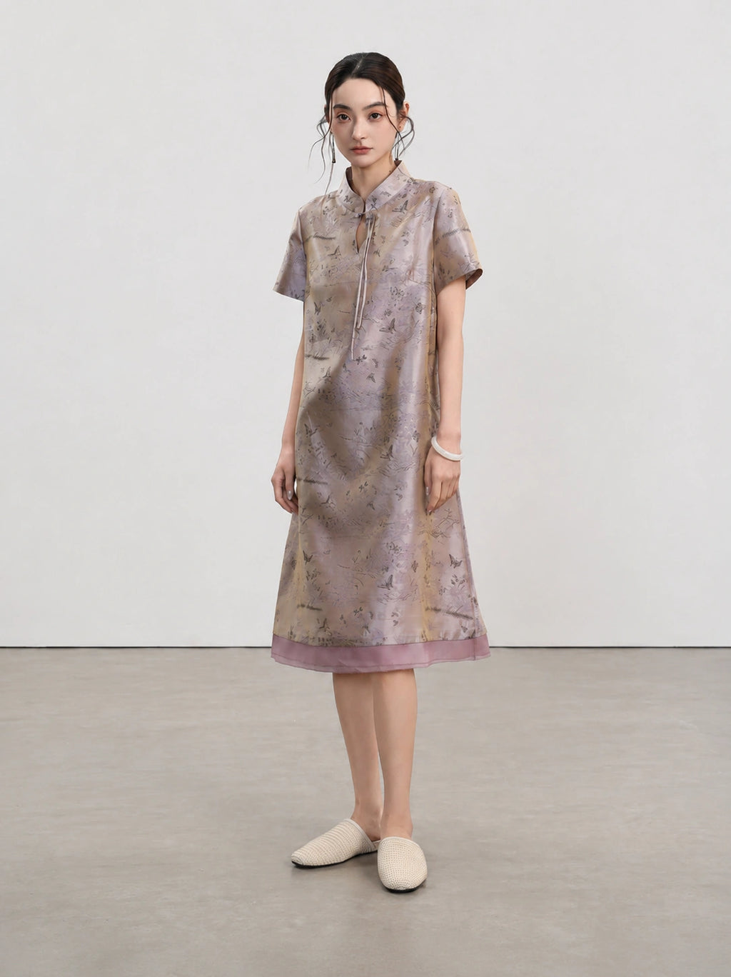 Full-length front view of the Jiangnan-inspired silk qipao with short sleeves and layered hem