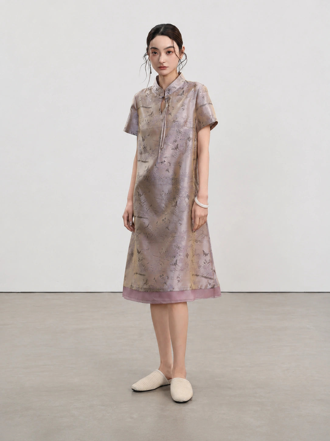 Full-length front view of the Jiangnan-inspired silk qipao with short sleeves and layered hem
