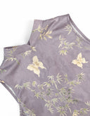 Close-up of the lavender polyester fabric with bamboo, floral and butterfly motifs