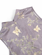 Close-up of the lavender polyester fabric with bamboo, floral and butterfly motifs