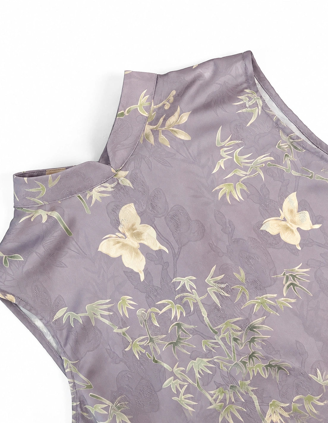 Close-up of the lavender polyester fabric with bamboo, floral and butterfly motifs