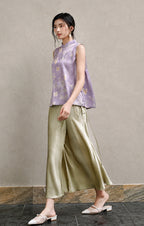 Side view of Gambiered Silk lavender Mandarin-collar vest styled with flowing trousers