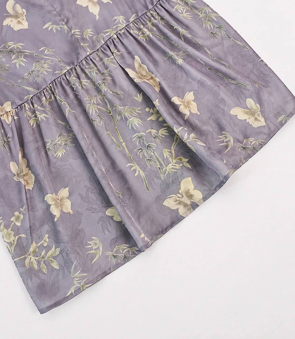 Close-up of the softly gathered back panel and bamboo-butterfly pattern