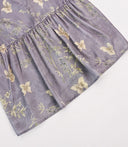 Close-up of the softly gathered back panel and bamboo-butterfly pattern