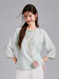 Front view of a Gambiered Silk water blue blouse with tonal leaf jacquard and three-quarter bell sleeves