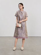 Model wearing the light purple jacquard silk qipao with an ivory clutch