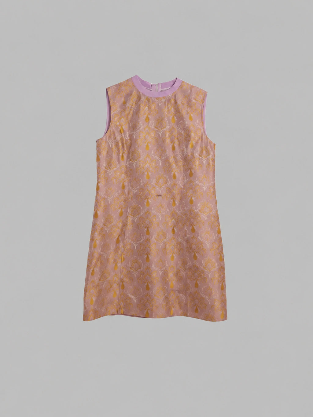 Front product view of a lilac-pink sleeveless A-line silk dress with golden brocade motifs.