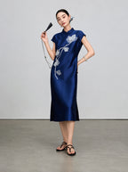 Full-length view of the navy sleeveless qipao with beaded magnolia embroidery