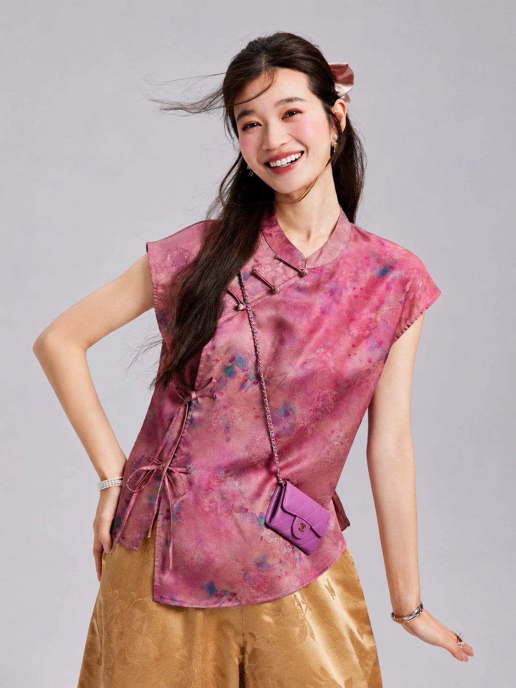 Close view of a Gambiered Silk floral top featuring knotted fastenings and adjustable side bow ties.