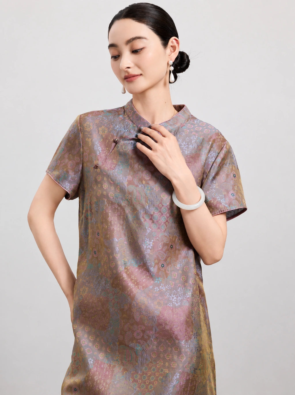 Upper-body view of the mulberry silk dress featuring a Mandarin collar and traditional frog-button accents.