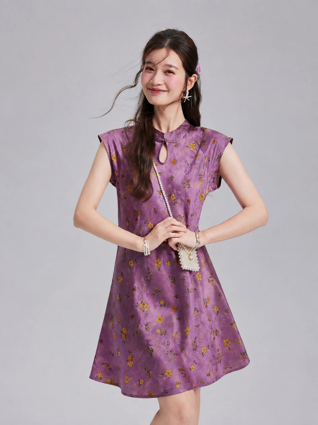 Front view of a Gambiered Silk floral dress with extended-shoulder sleeves and a keyhole neckline.