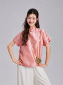 Front view of a Gambiered Silk mulberry silk top featuring short sleeves, a Mandarin collar and geometric motifs
