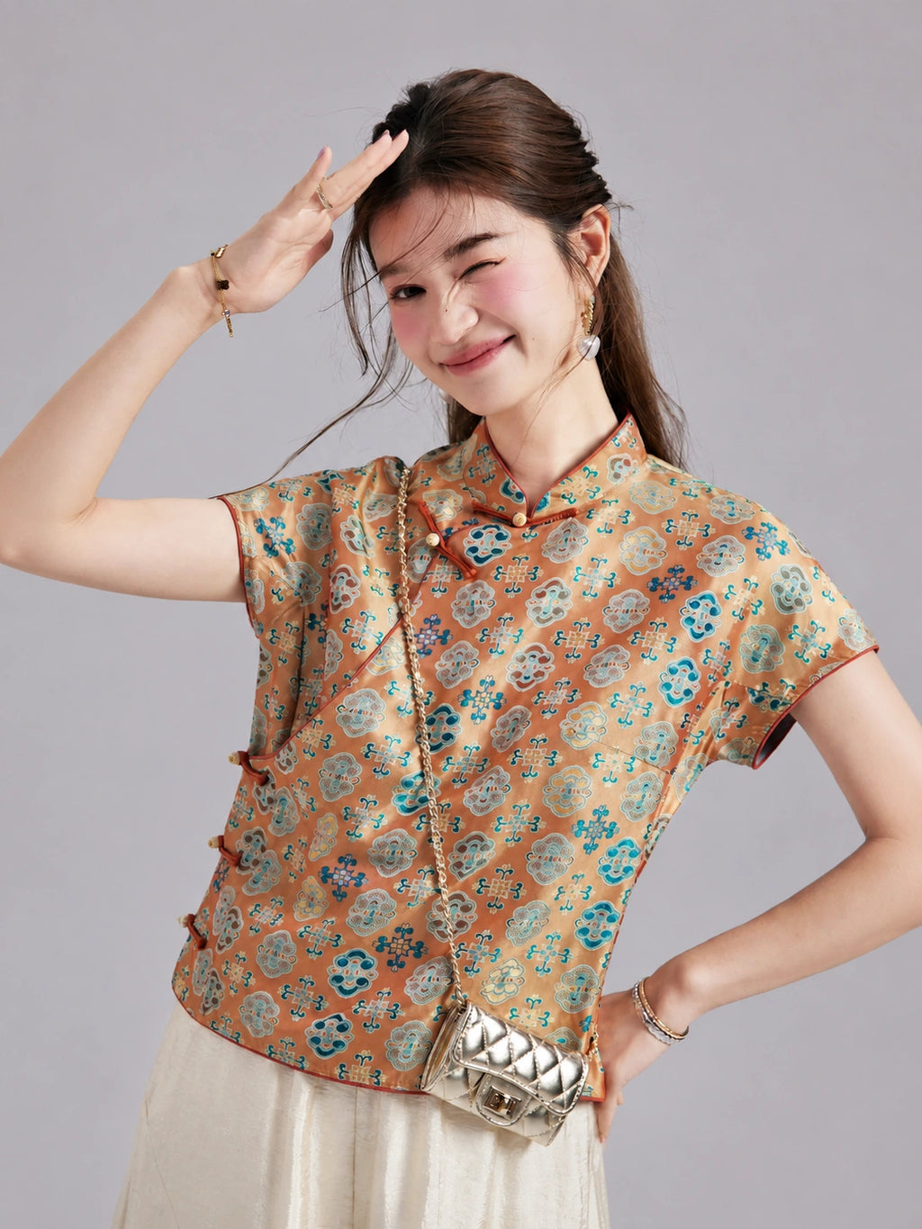 Gambiered Silk Shu brocade top featuring a Mandarin collar, asymmetric closure, contrast piping and frog buttons