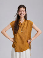 Gambiered Silk antique-gold top featuring a Mandarin collar, asymmetric neckline and ribbon-tie closures.