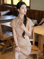 Woman wearing a mulberry silk floral cheongsam dress indoors