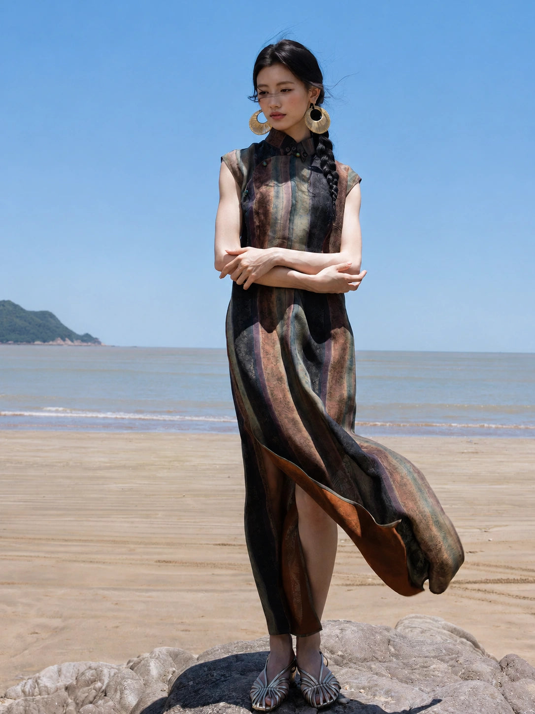 Woman wearing a 100% Mulberry Silk Mandarin collar maxi dress by the seaside