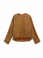Front view of an olive floral mulberry silk pullover top with long straight sleeves