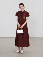 Front view of the oxblood-red mulberry silk A-line qipao with short sleeves