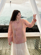 Front view of a floral-patterned mulberry silk top with a mandarin collar and frog closures