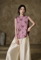 Front view of the pink sleeveless Mandarin-collar vest featuring colorful embroidered horse motifs