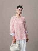 Model wearing pink viscose and mulberry silk blouse with relaxed fit.