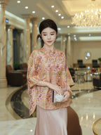Front view of a pink Chinese-inspired mulberry silk top with a diagonal front closure