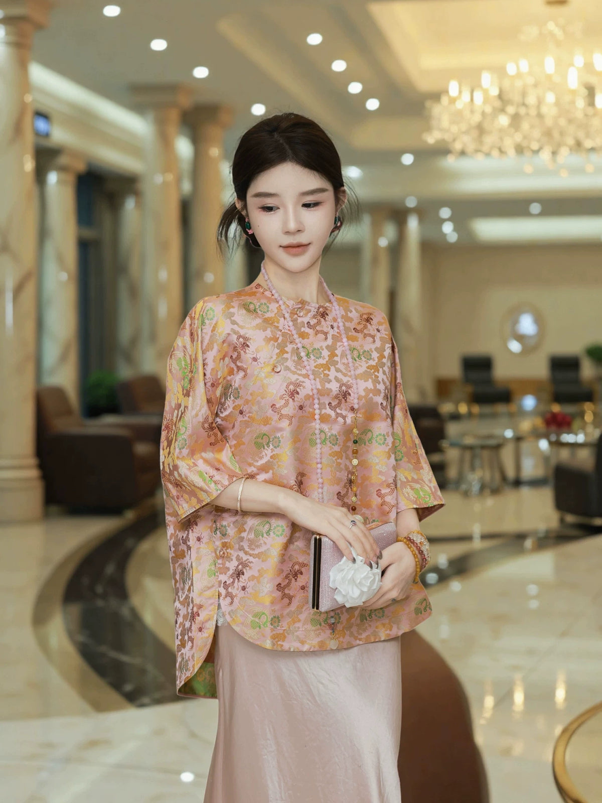 Front view of a pink Chinese-inspired mulberry silk top with a diagonal front closure