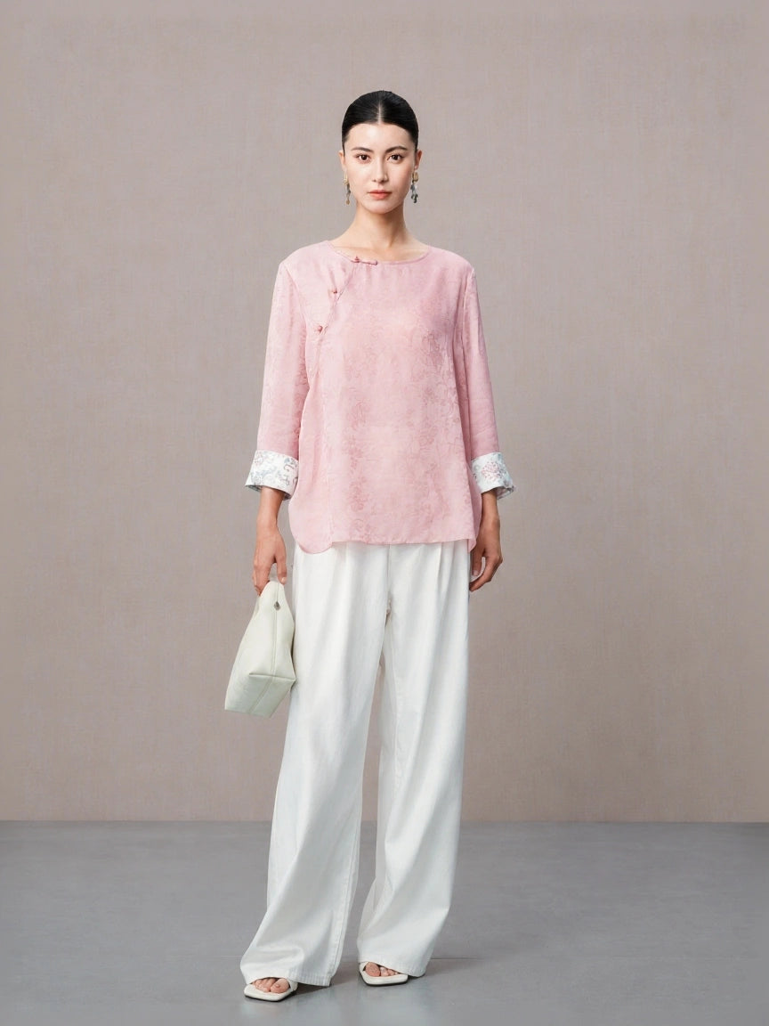 Pink Chinese inspired silk blouse with traditional knot buttons.
