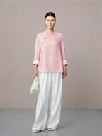 Pink Chinese inspired silk blouse with traditional knot buttons.