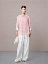 Pink Chinese inspired silk blouse with traditional knot buttons.