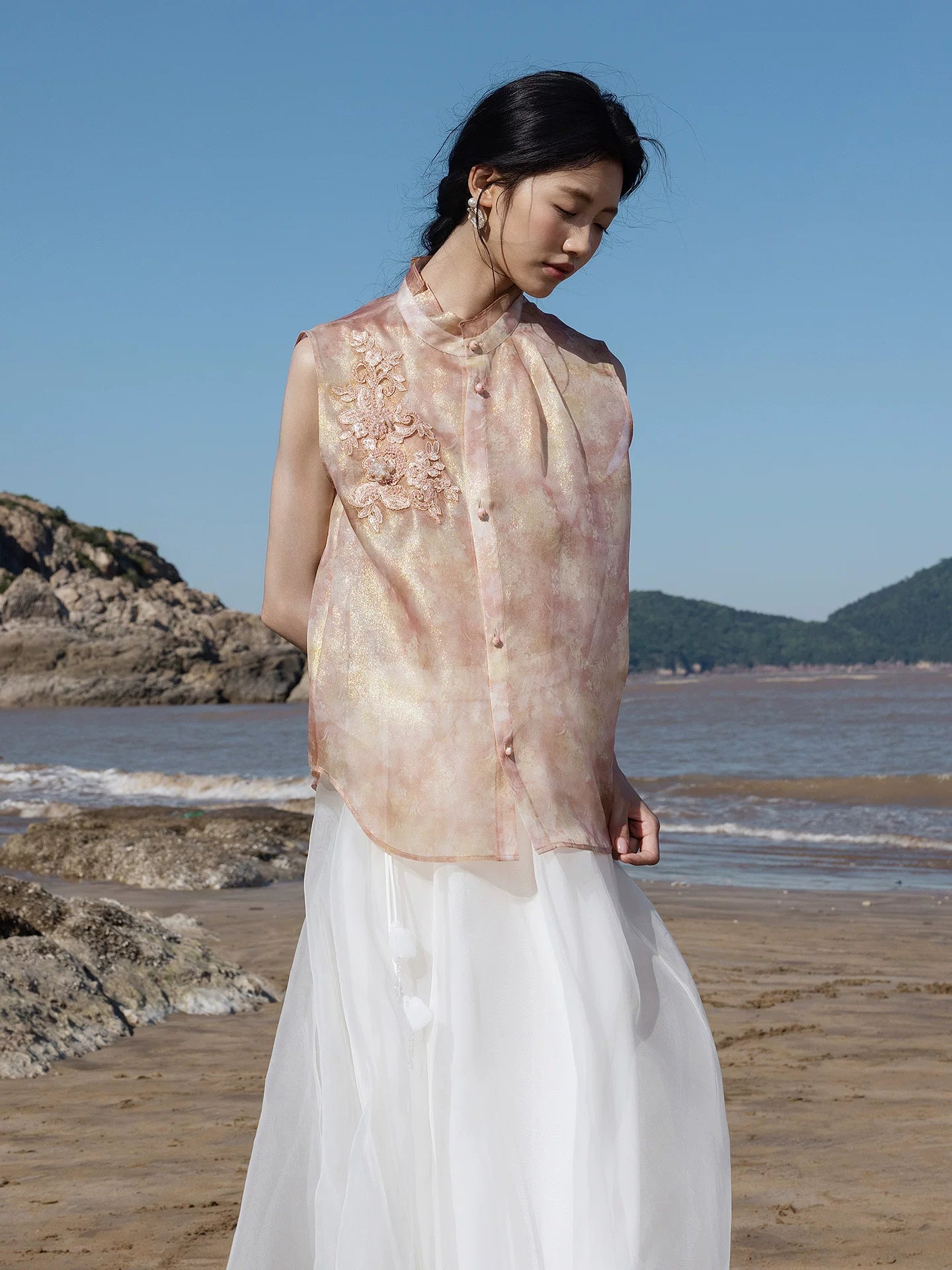 Side view of a blush pink embroidered mulberry silk sleeveless top with mandarin collar from Gambiered Silk.