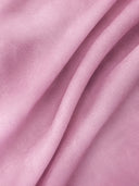 Close-up view of delicate pink mulberry silk organza fabric texture