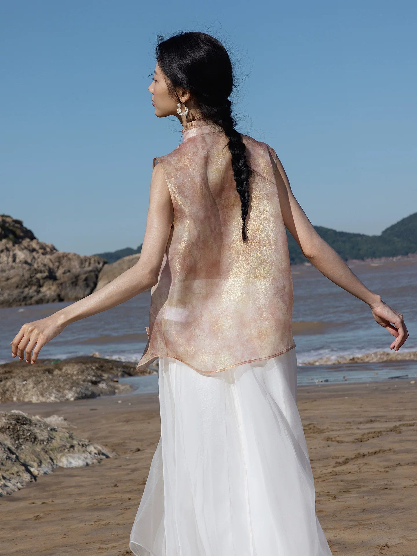 Back view of a blush pink mulberry silk sleeveless top with elegant drape by Gambiered Silk.