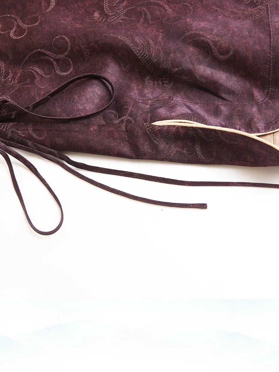 Front view of a plum Chinese-style silk-blend top with a diagonal closure and relaxed silhouette
