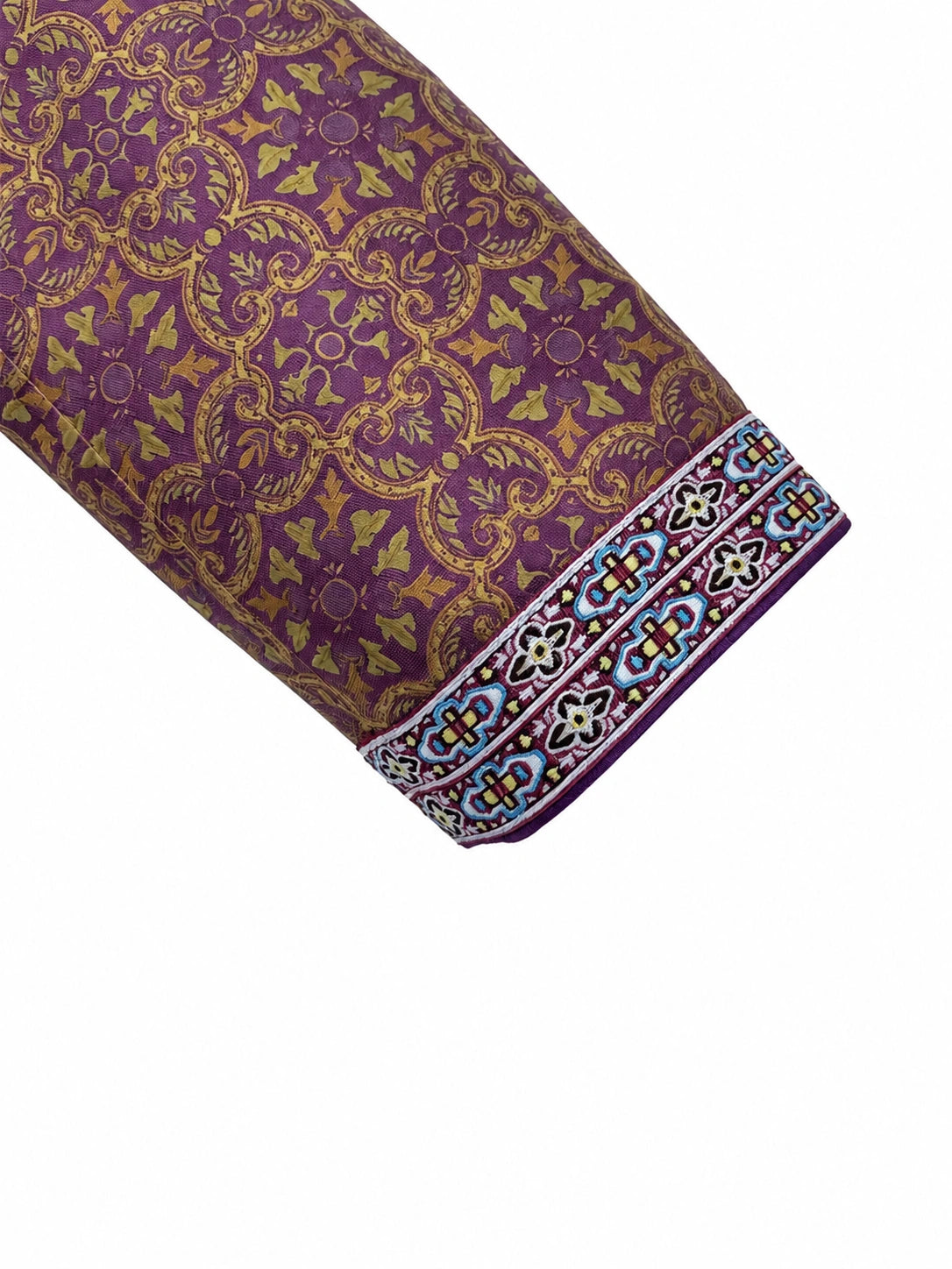 Close-up of the plum patterned silk jacket sleeve with decorative embroidered cuff trim