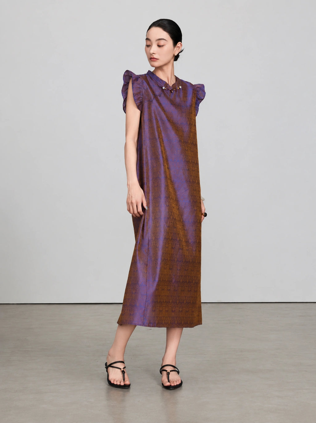 Full-length front view of a purple-bronze silk jacquard dress with a Mandarin collar and relaxed silhouette.