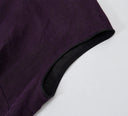 Close-up of purple crackle-textured gambiered silk fabric with contrasting black piping.